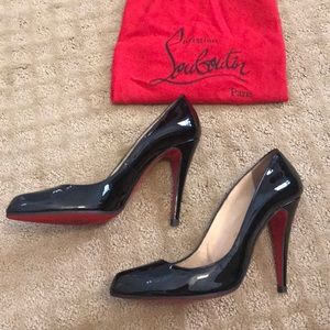 Black patent leather Christian Louboutin heels.